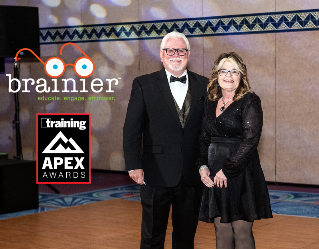 Brainier President, Jerry Cox and raffle winner, Wendy Youells at the Apex Awards.